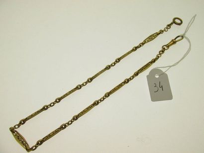 1 gold watch chain with openworked and faceted...