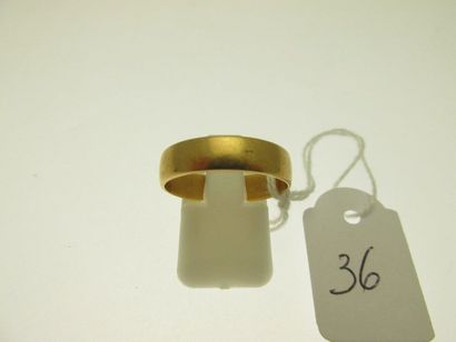 1 gold wedding ring engraved with two small...
