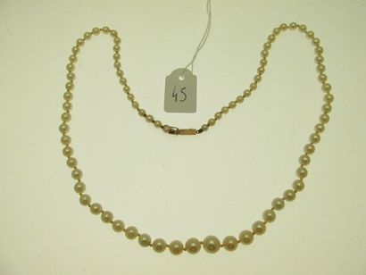 1 necklace of cultured pearls falling gold...
