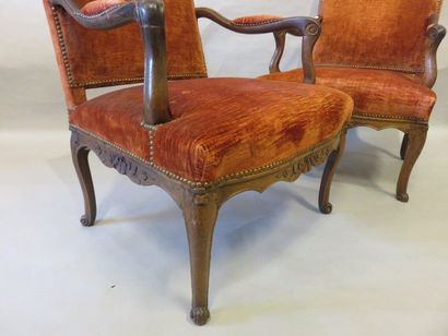 FAUTEUIL Pair of armchairs in carved natural wood. Regency style. Red velvet uph...