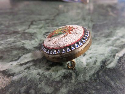 null Round metal brooch with Italian micro mosaic pattern of insect and frieze.
