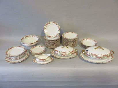 null Service in white Limoges porcelain with red flowers edging. 51 pieces.