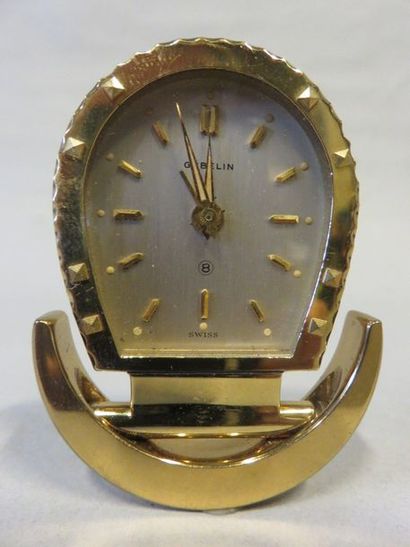 REVEIL Gubelin travel alarm clock in gilded metal.