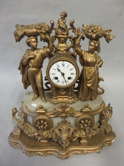 null Clock in ruler with peasant couple decoration. 45x42x17 cm