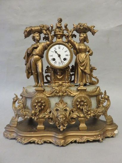 null Clock in ruler with peasant couple decoration. 45x42x17 cm