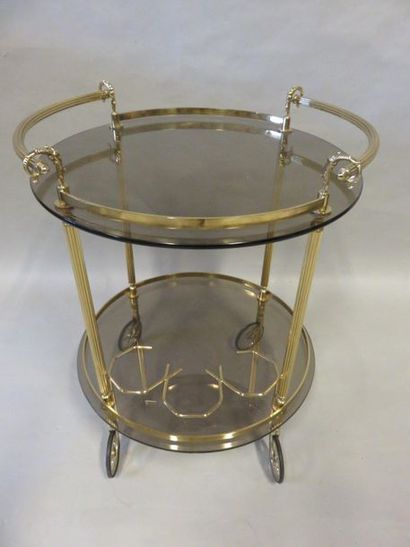 * Table roulante Rolling table with two smoked glass tops, brass frame. 73x58 cm