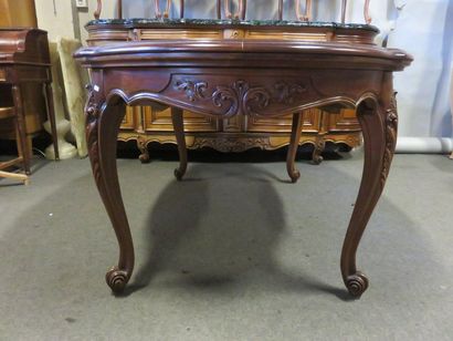 * Dining room furniture in carved fruitwood: four doors and two drawers, green marble...