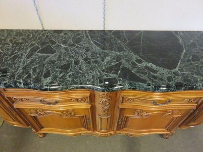 * Dining room furniture in carved fruitwood: four doors and two drawers, green marble...