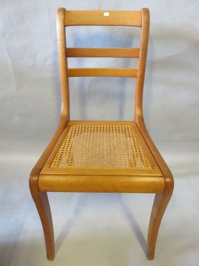 CHAISES Four cane chairs (two wafers are missing) and a natural wood chest of dr...