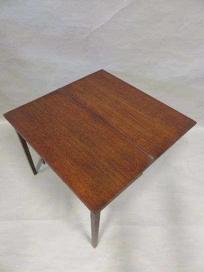 Table Table with one drawer and a flap top with sheathed legs.