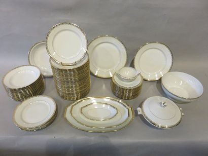 * Service White porcelain dinner service with gold edging. A B France. 69 pieces