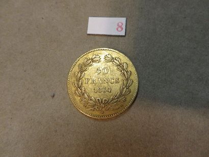 null Une pièce de quarante francs français en or de 1834 (12,8gr)