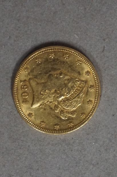 null Une pièce de dix dollars US en or (16,5grs)