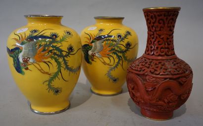 null Three Chinese vases: a yellow enamelled pair (12 cm) and one in red lacquer...