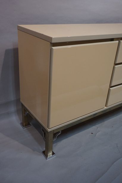 DESIGN Salmon lacquered wood sideboard with three drawers and chromed base (scratches)....