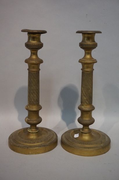 * Pair of bronze candlesticks (wear). 28 m