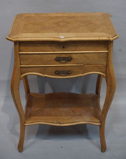 * A small veneered dressing table with a tilting top and two drawers. Louis XV style....