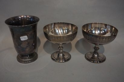 null Lot of silver plated metal, three cups and five pourers. A black earthenware...