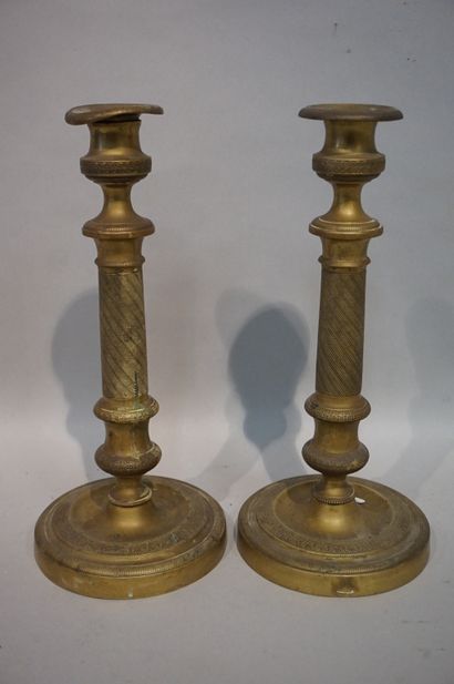 * Pair of bronze candlesticks (wear). 28 m