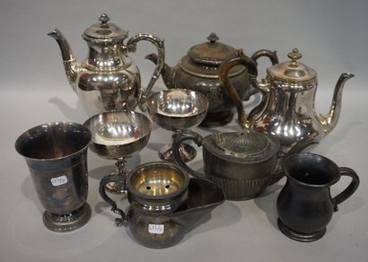 null Lot of silver plated metal, three cups and five pourers. A black earthenware...