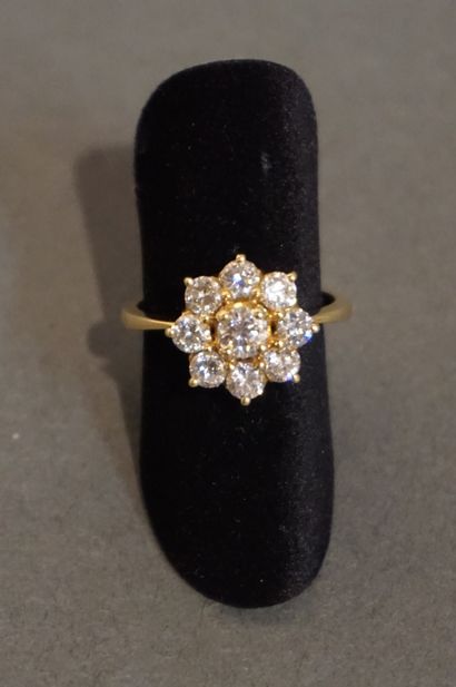 Bague Gold ring set with seven diamonds, one of which weighs approximately 0.25 carats...