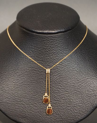 POIRAY POIRAY: two articulated gold pendants set with tiger's eye and diamonds. And...