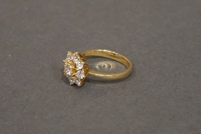 Bague Gold ring set with seven diamonds, one of which weighs approximately 0.25 carats...