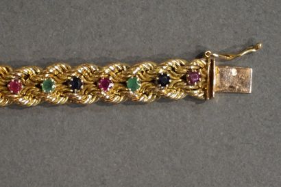 Bracelet Bracelet souple en or quatorze carats serti de saphirs, émeraudes et rubis...