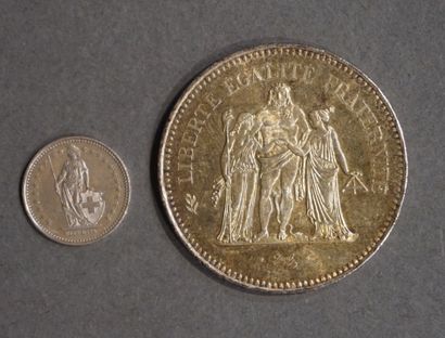 null French fifty franc silver coin (29,6grs) and a Swiss half franc silver coin...