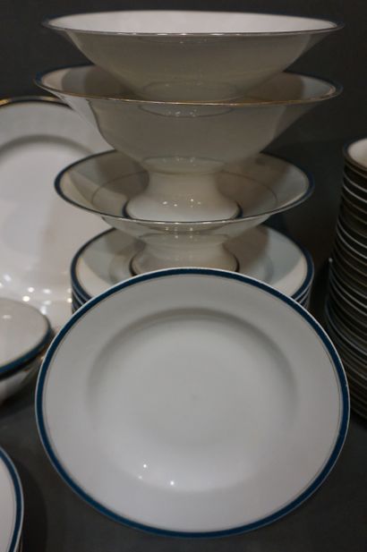 null White porcelain dinner service with blue border. 59 pieces (cracks, chips).