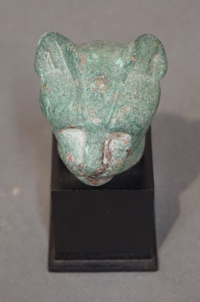 null Head of a cat of Bastet, the eyes formerly inlaid. Bronze with green patina....