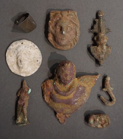 Lot including a lead discoid weight decorated...