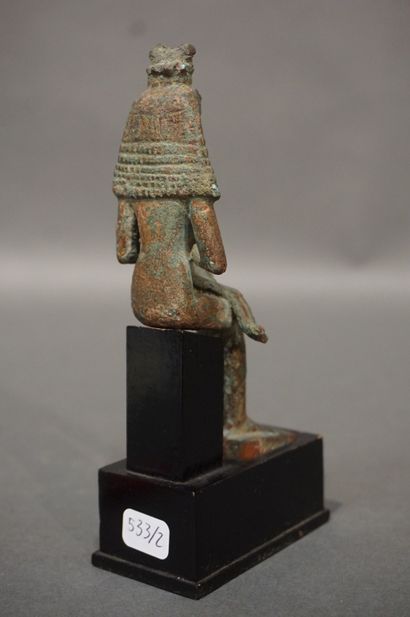 null Statuette of Isis lactans. Isis is represented with a large wig topped with...