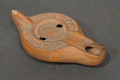 Oil lamp with a channel spout decorated with...