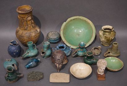  Eight oil lamps and six earthenware cups...