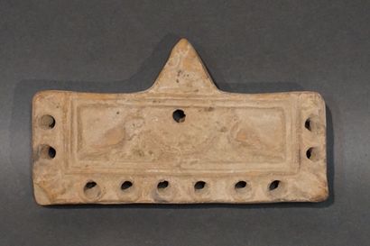 null Rectangular oil lamp with ten spouts and a medallion representing two doves...