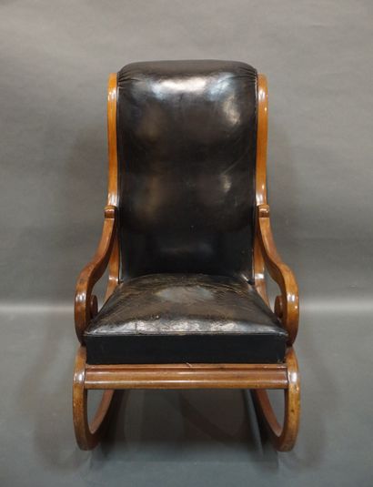 Rocking chair Rocking chair in mahogany trimmed with black leather. Old English work....