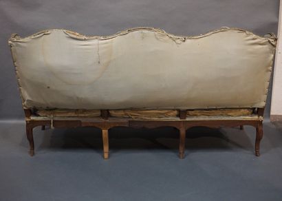 Canapé Sofa in natural wood carved with shells, upholstered with green velvet (restorations)....