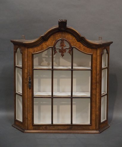 Vitrine Small hanging display case in walnut and walnut veneer; the pediment with...