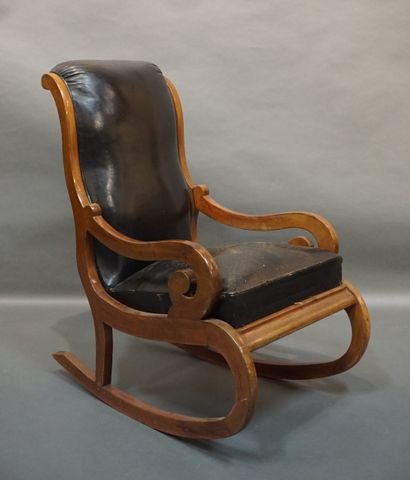 Rocking chair Rocking chair in mahogany trimmed with black leather. Old English work....