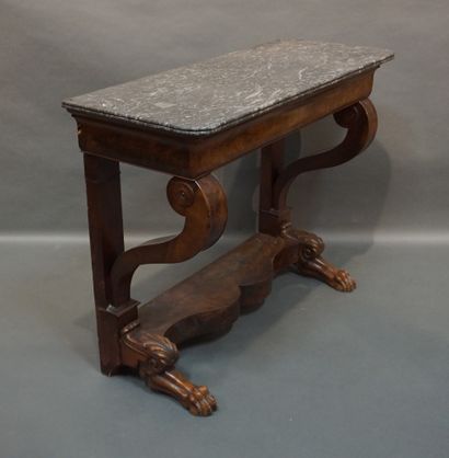 Console 
Mahogany and mahogany veneer console with hocked legs and a drawer in the...