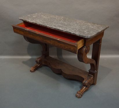 Console 
Mahogany and mahogany veneer console with hocked legs and a drawer in the...