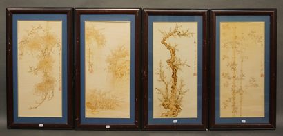 Suite of four Asian pyrographed panels: 