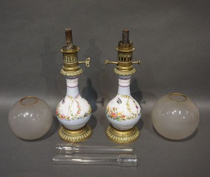 null Pair of porcelain oil lamps decorated with butterflies and flowers, on a blue...