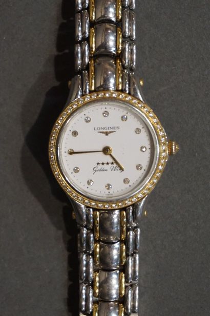 LONGINES Montre bracelet de dame modèle GOLDEN WING en acier et or. Lunette et index...