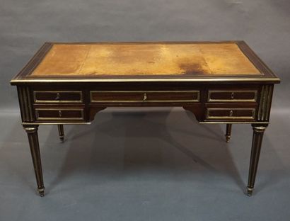 Bureau Plat Mahogany and brass fillet flat desk with four drawers and two pulls....