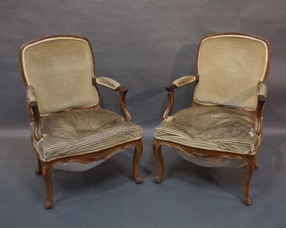 FAUTEUILS Pair of molded natural wood armchairs, with flat backs, upholstered in...