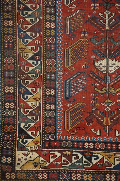 null Carpet with geometric decoration on red background and polychrome border. 265x135...