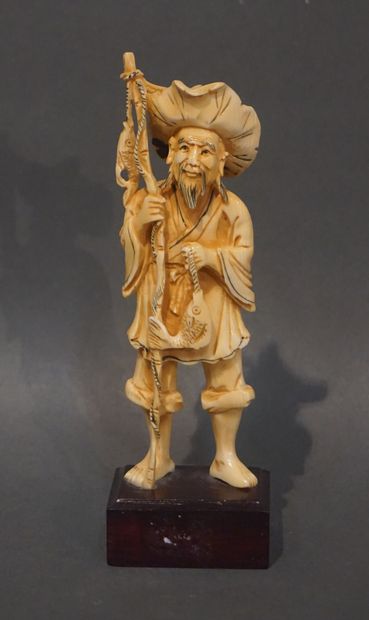 null Asian statuette "Fisherman with a rod and fish". 15 cm