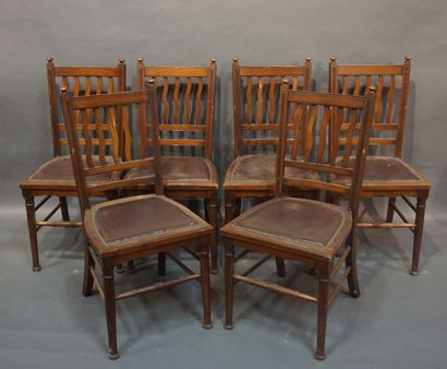 null Six mahogany chairs with openwork backs, upholstered in brown leather. 93x43x50...